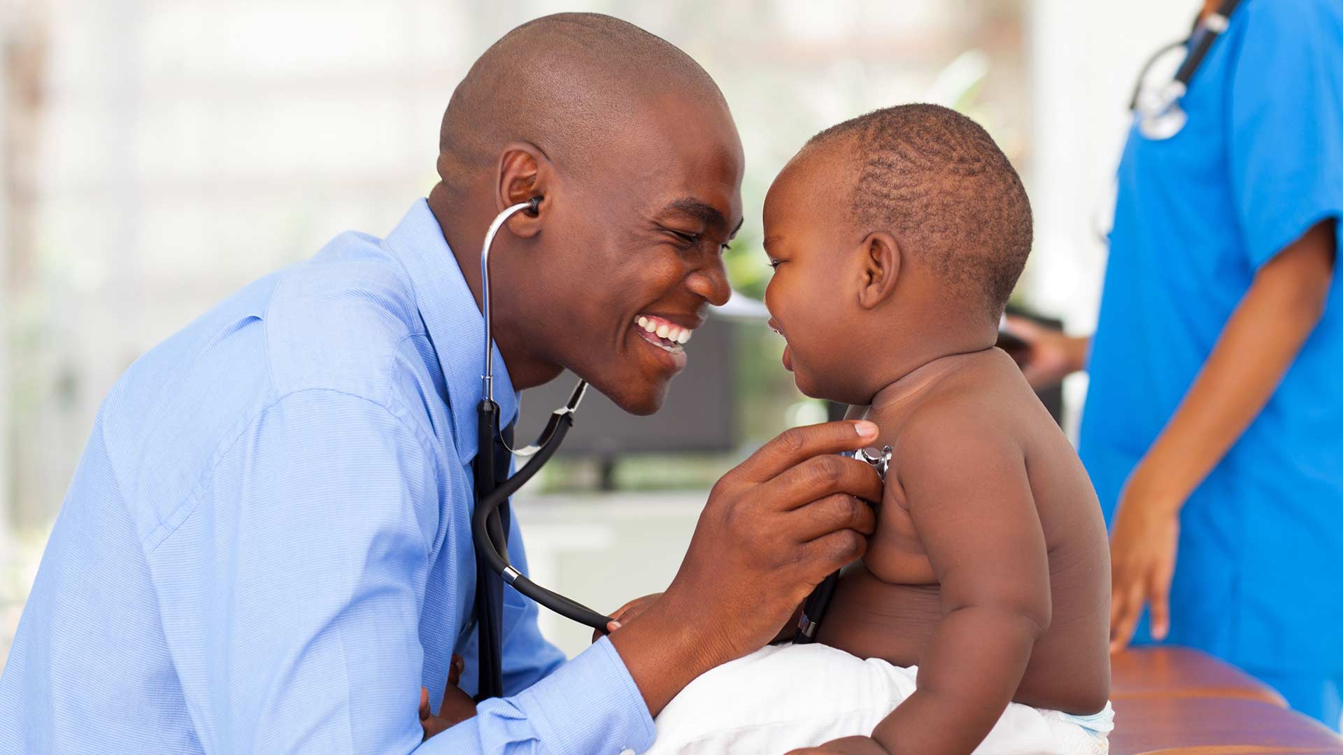 Doctor and baby examination